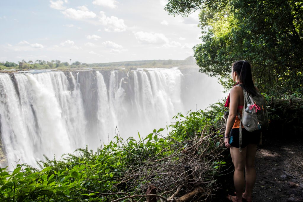 young female tourist looking out at victoria falls 2024 06 28 04 44 46 utc