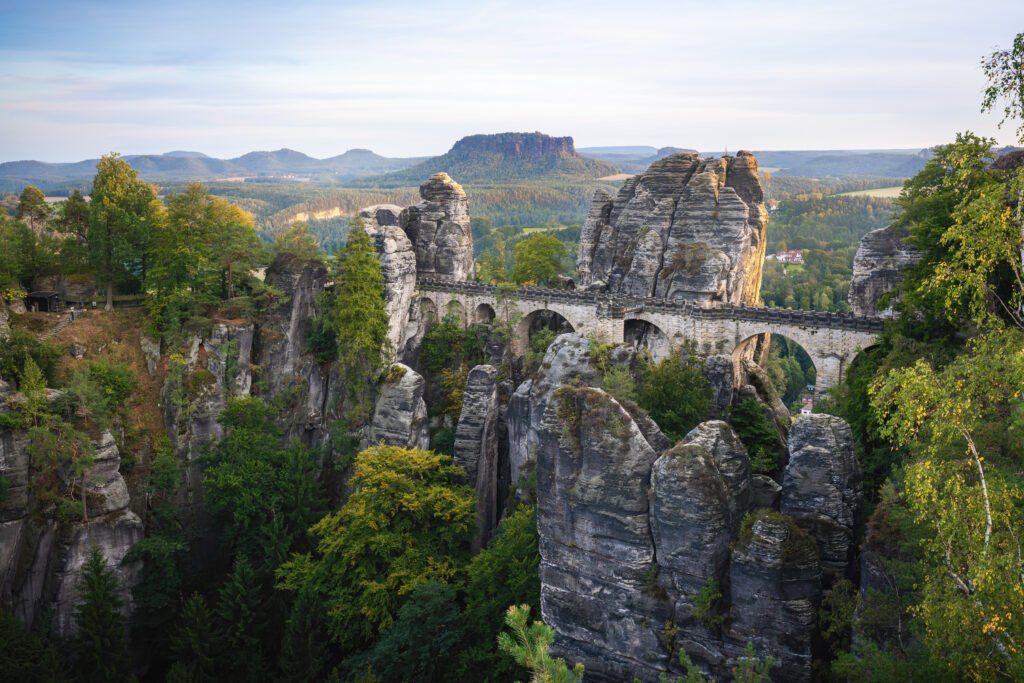 Hidden gems in Europe: Bastei Bridge with Lilienstein Mountain on background in Saxon Switzerland National Park, Germany