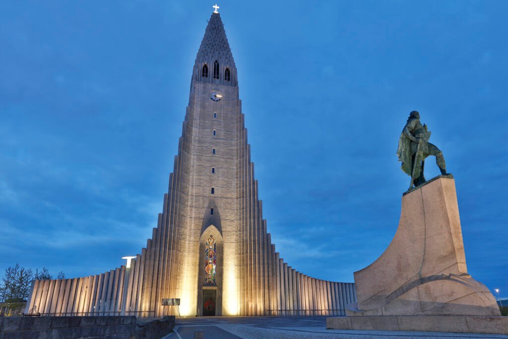 Hallgrimskirkja church and statue illuminated at night, Reykjavik, Iceland