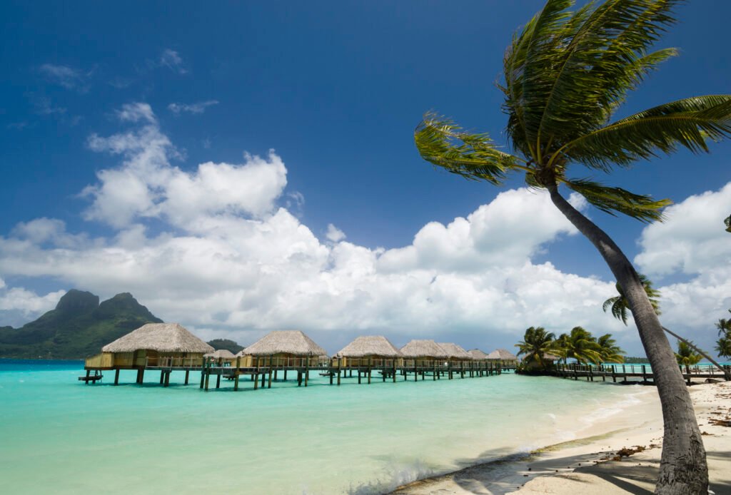 palm trees and beach resort stilt houses bora bor 2024 06 25 18 22 52 utc