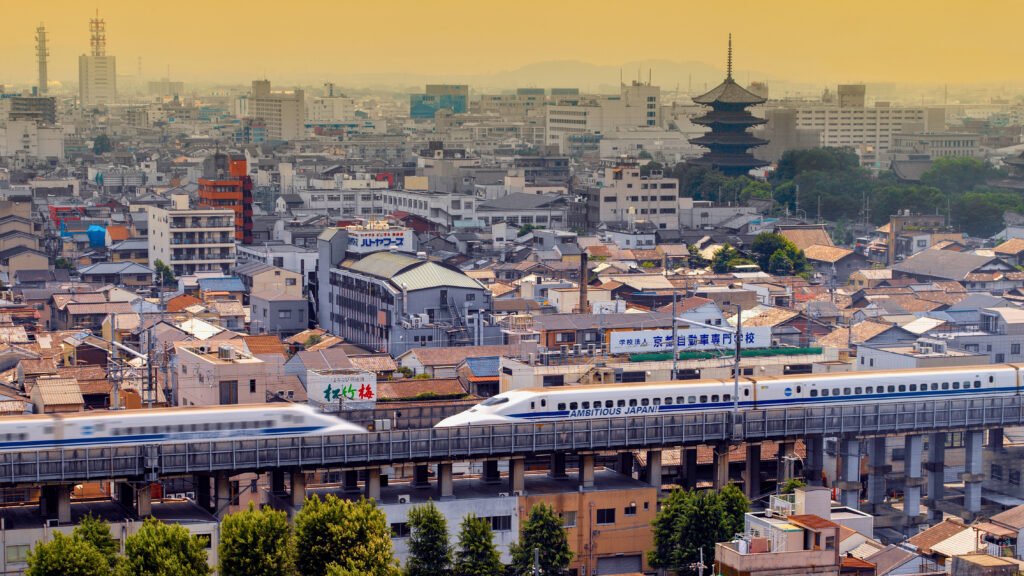 Two high speed Shinkansen bullet trains pass each other in the city of Kyoto in Japan.